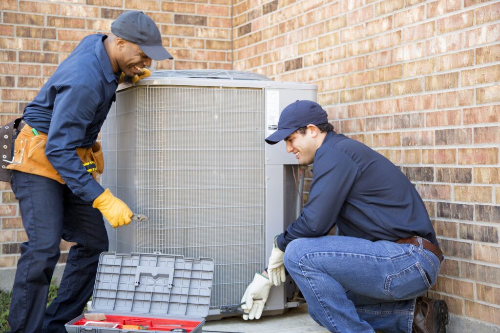 HVAC team replacing outdoor condenser unit